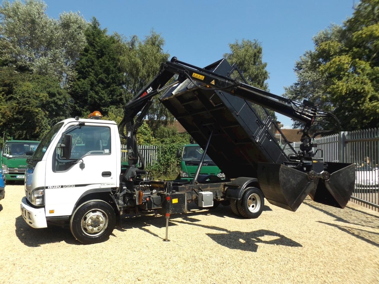 Nqr Tipper with Crane and Bucket Grab - 7.5T Manual Diesel